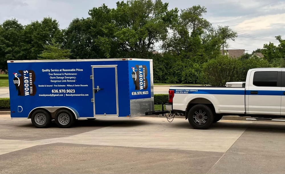B. Woody's blue branded trailer and white Ford Super Duty in a commercial parking area